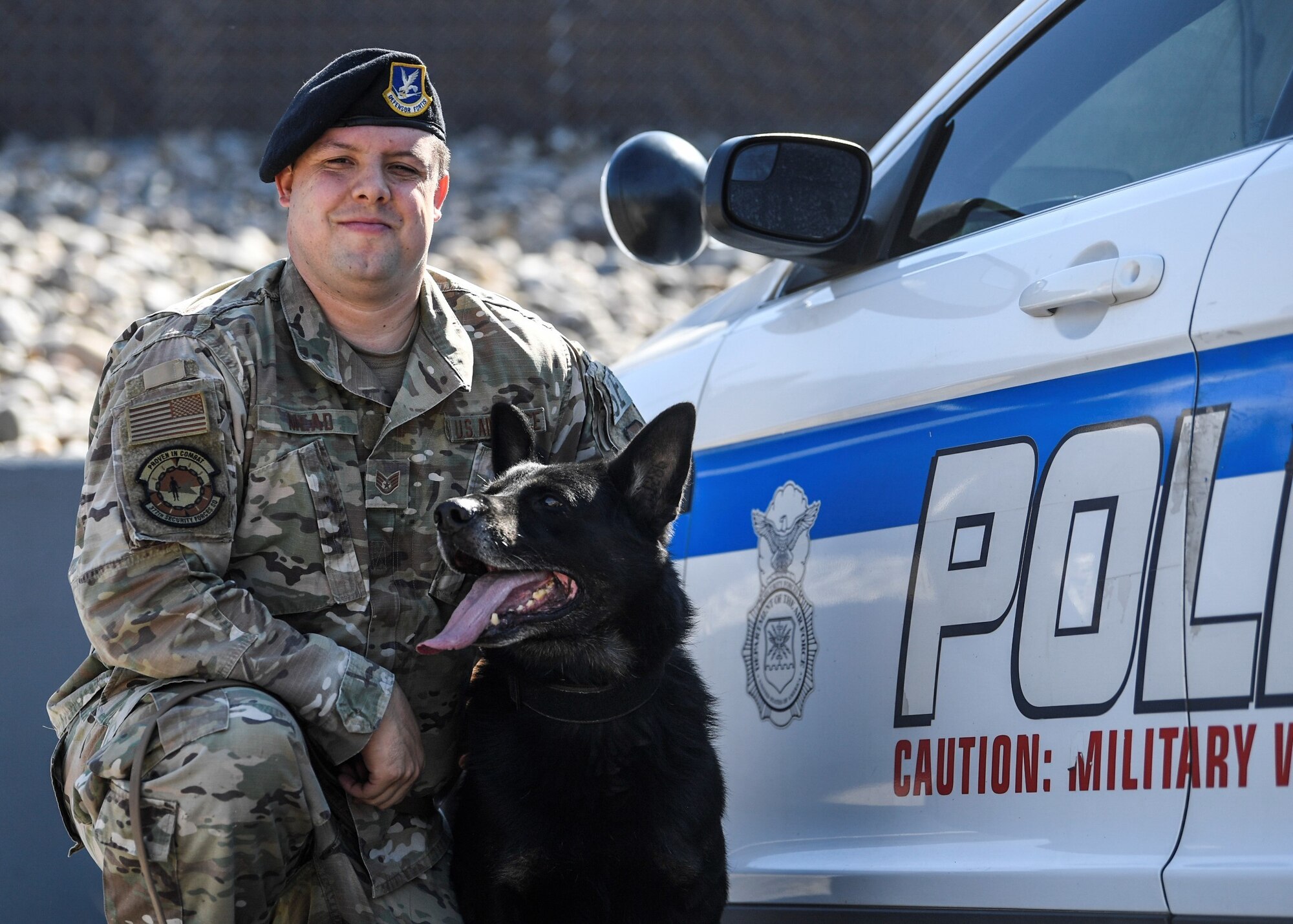 military working dog handler poses for photo