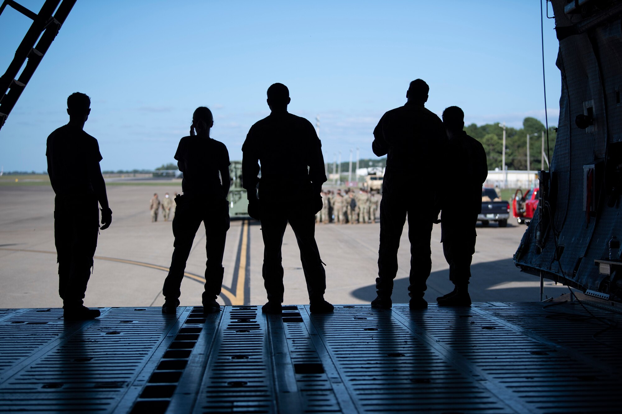 U.S. Airmen and Soldiers train together to load a Chinook-47 into a C-5M Super Galaxy