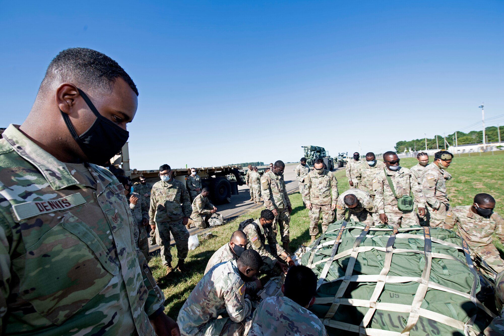 U.S. Airmen and Soldiers train together to load a Chinook-47 into a C-5M Super Galaxy