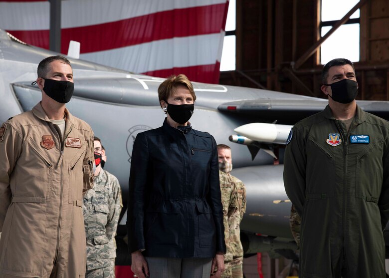 Secretary of the Air Force Barbara Barrett poses for a photo alongside Airmen including Col. Richard Goodman (right), 366th Fighter Wing commander, and Lt. Col. Travis Stephens (left), 391st Fighter Squadron commander, at Mountain Home Air Force Base, Idaho Sept. 24, 2020. Barrett’s visit consisted of seeing firsthand how the Gunfighters are committed to readiness through innovation, strategic partnerships and building leaders. (U.S. Air Force photo by Airman Andrea Rozoto)