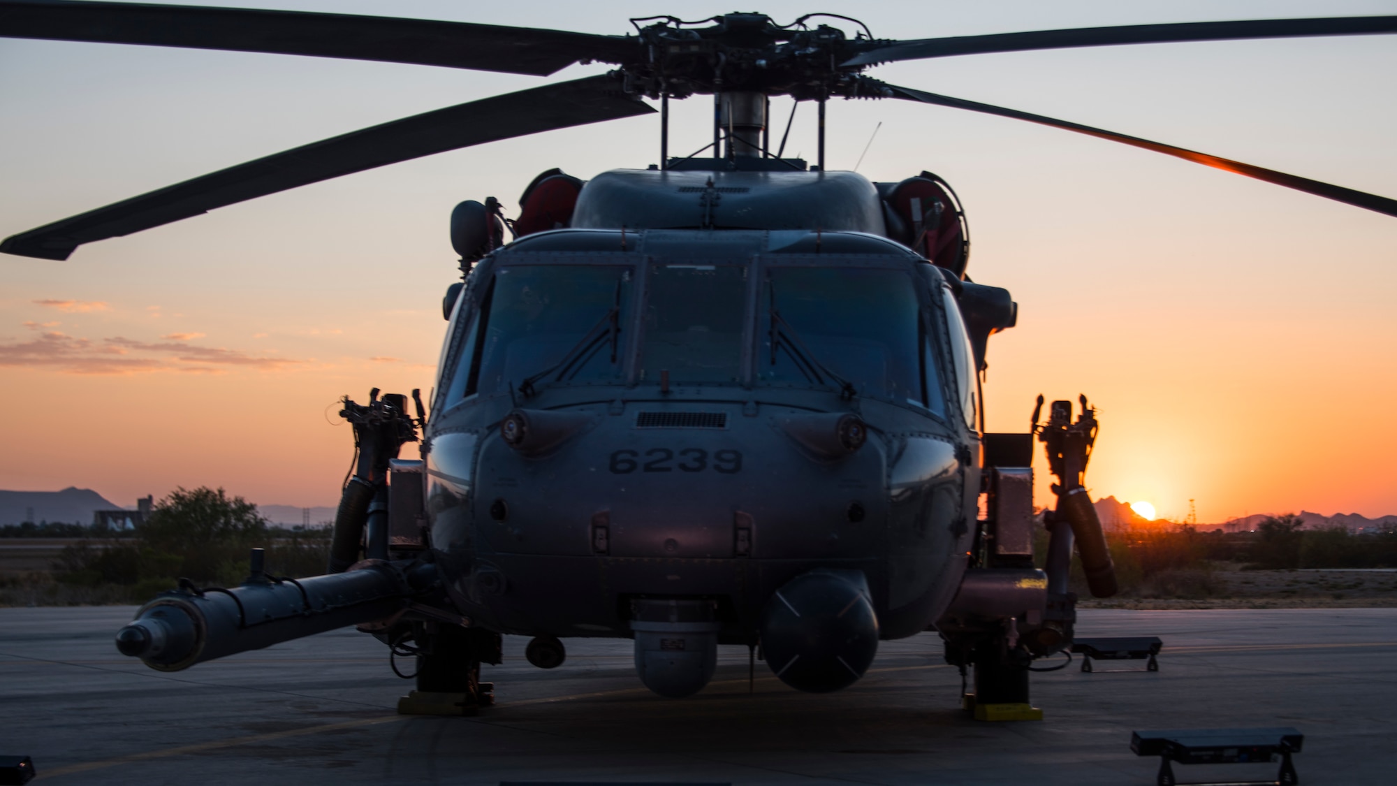 A photo of a helicopter on the flight line
