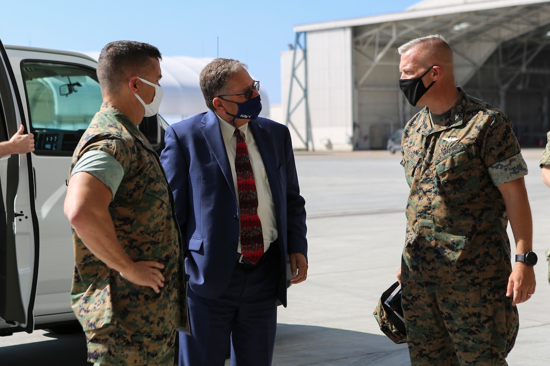 Honorable Charles A. Williams, the assistant secretary of the Navy for Energy, Installations and Environment, and Col. Charles B. Dockery, the commanding officer of Marine Corps Air Station Miramar, listen to a brief during a tour of MCAS Miramar, California, Sept. 22, 2020. During his visit, Williams toured the station’s hangars and privatized military housing, spoke with senior leaders, presented safety awards to Marines, and familiarized himself with Miramar’s microgrid and power plant.  (U.S. Marine Corps photos by Lance Cpl. Krysten Houk)