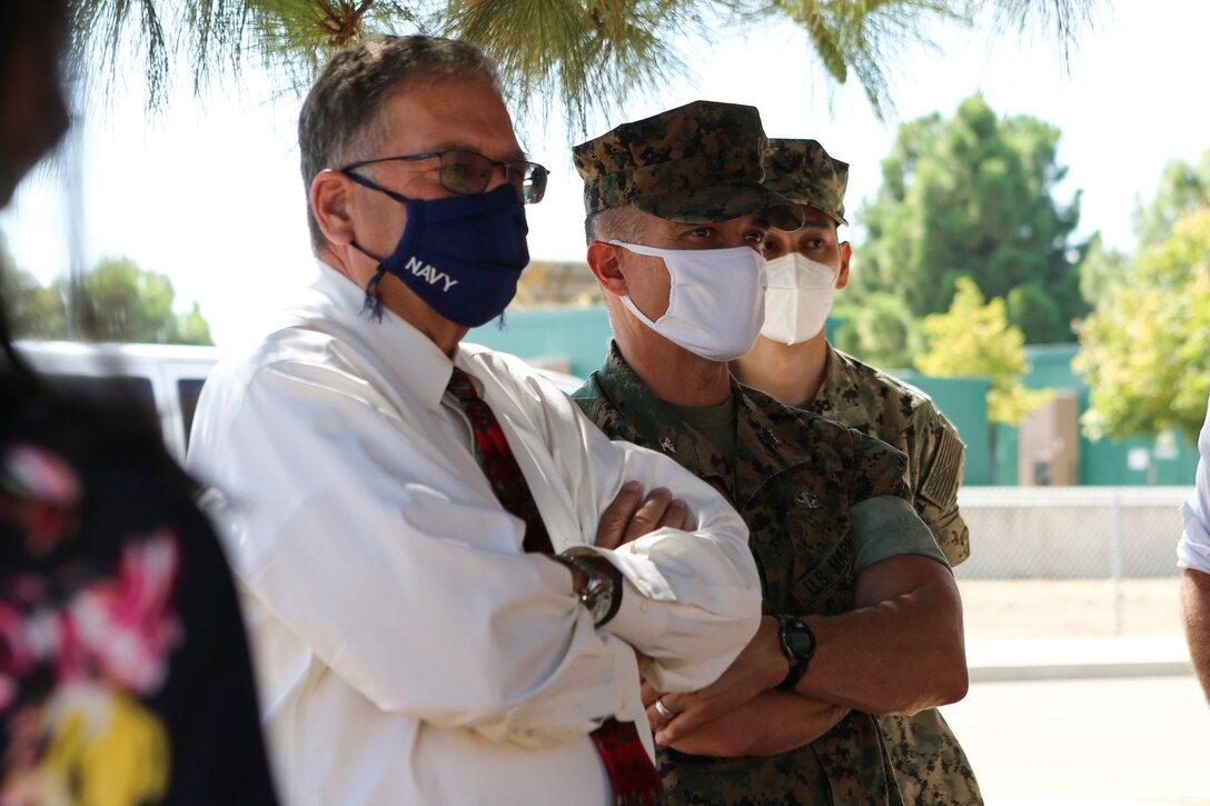 Honorable Charles A. Williams, the assistant secretary of the Navy for Energy, Installations and Environment, and Col. Charles B. Dockery, the commanding officer of Marine Corps Air Station Miramar, listen to a brief during a tour of MCAS Miramar, California, Sept. 22, 2020. During his visit, Williams toured the station’s hangars and privatized military housing, spoke with senior leaders, presented safety awards to Marines, and familiarized himself with Miramar’s microgrid and power plant.  (U.S. Marine Corps photos by Lance Cpl. Krysten Houk)