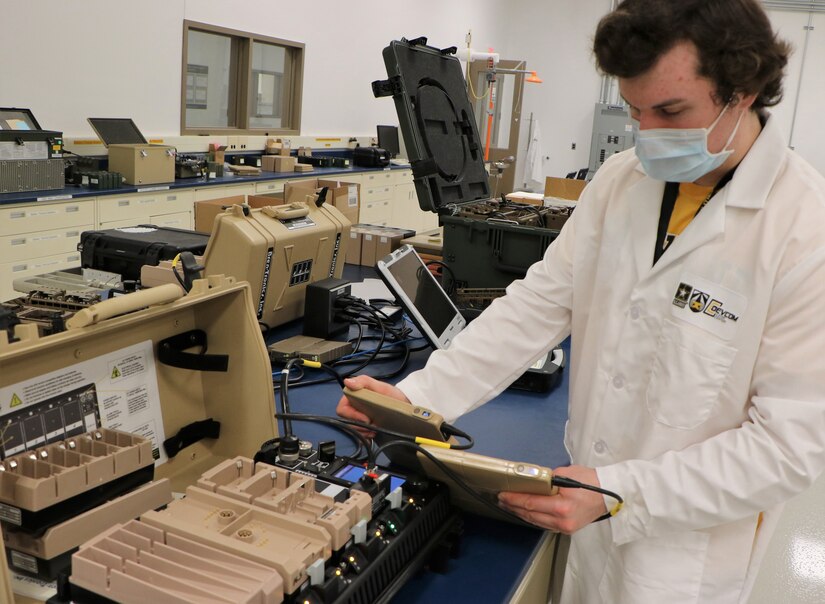 A researcher in a lab conducts a test on a wearable battery prototype.