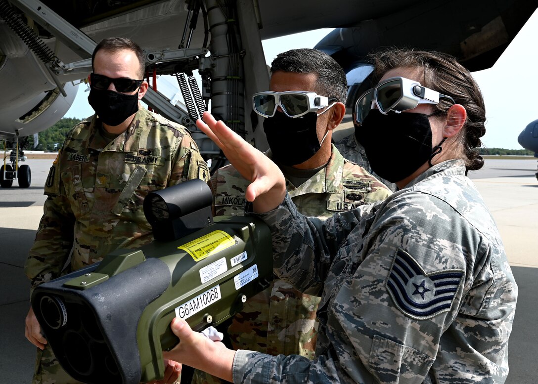 Maj. Brandon LaBelle and NH Adjutant Gen. David Mikolaities, NHARNG, observe Tech Sgt. Ashley LaValley's demonstration on how a MEON infrared tester is used to test the KC-46 Pegasus's missle defense system on Sept. 16 at Manchester-Boston Regional Airport. Mikolaities toured the airport, where KC-46s and airmen are temporarily stationed while Pease repaves its runway. Photo by Staff Sgt. Charles Johnston, deputy state PAO.
