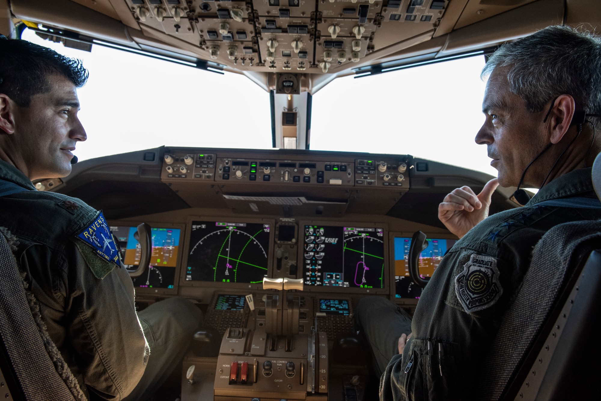 Maj. Robert Dobbins, 22nd Air Refueling Wing KC-46 Pegasus aircraft commander, and Gen. Ken Wilsbach, Pacific Air Forces commander, talk about the aircraft’s capabilities during a demo flight, Joint Base Pearl Harbor-Hickam, Hawaii, Sept. 22, 2020. The flight served as an opportunity for Wilsbach to become familiar with the KC-46 as well as learn about the Advanced Battle Management System being tested aboard the aircraft. (U.S. Air Force photo by Staff Sgt. Hailey Haux)