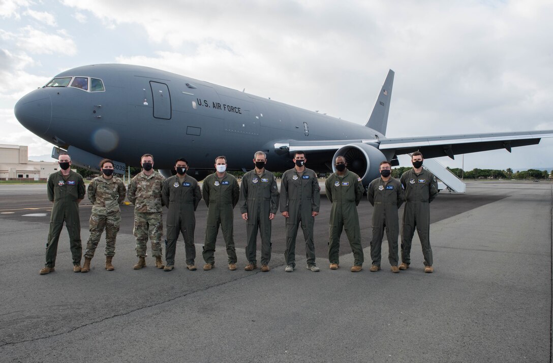 Gen. Ken Wilsbach (center), Pacific Air Forces commander, takes a group photo with the aircrew of a KC-46 Pegasus after a demo flight to learn about the aircraft’s capabilities, Joint Base Pearl Harbor-Hickam, Hawaii, Sept. 22, 2020. The flight served as an opportunity for Wilsbach to become familiar with the KC-46 as well as learn about the Advanced Battle Management System being tested aboard the aircraft. The KC-46 provides increased survivability, enhanced communication, self-protection and situational awareness required for competing, deterring and winning in today’s complex security environment. (U.S. Air Force photo by Staff Sgt. Hailey Haux)