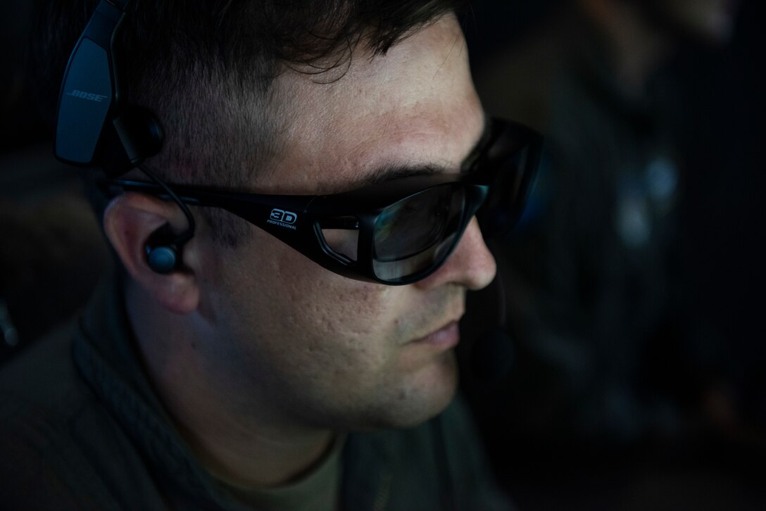 Staff Sgt. John Levano, 344th Air Refueling Squadron, prepares the KC-46 Pegasus to refuel a C-17 Globemaster III during a demo flight for Gen. Ken Wilsbach, Pacific Air Forces commander, Joint Base Pearl Harbor-Hickam, Hawaii, Sept. 22, 2020. The flight served as an opportunity for Wilsbach to become familiar with the KC-46 as well as learn about the Advanced Battle Management System being tested aboard the aircraft. (U.S. Air Force photo by Staff Sgt. Hailey Haux)
