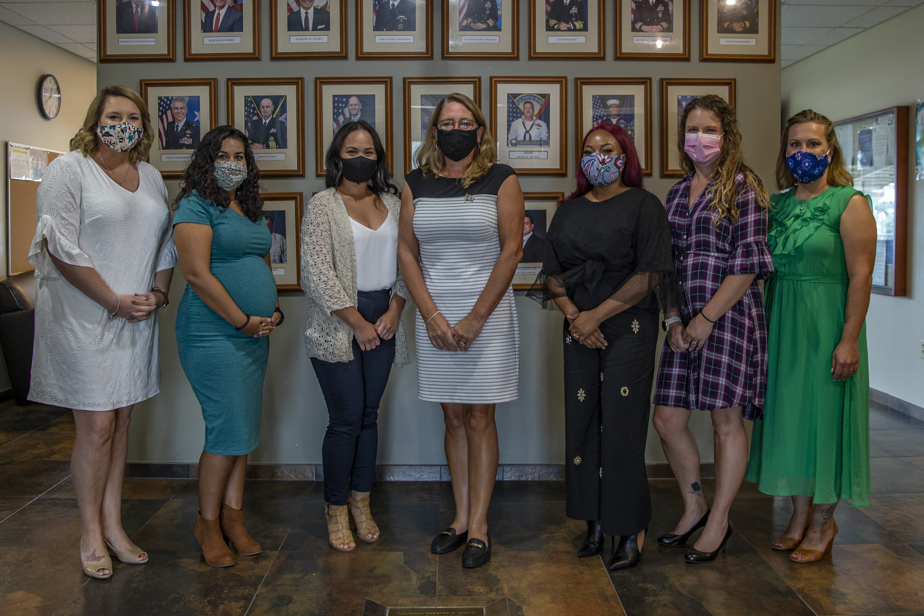 Leah Esper, the wife of U.S. Secretary of Defense Dr. Mark Esper, center, poses for a group photograph after a roundtable discussion with service members’ spouses during a luncheon at the Joint Region Marianas headquarters building in Asan, Guam, August 29, 2020.