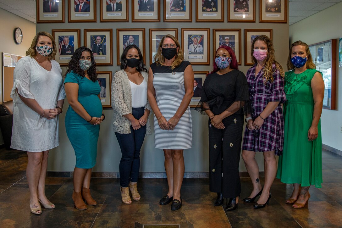 Leah Esper, the wife of U.S. Secretary of Defense Dr. Mark Esper, center, poses for a group photograph after a roundtable discussion with service members’ spouses during a luncheon at the Joint Region Marianas headquarters building in Asan, Guam, August 29, 2020.