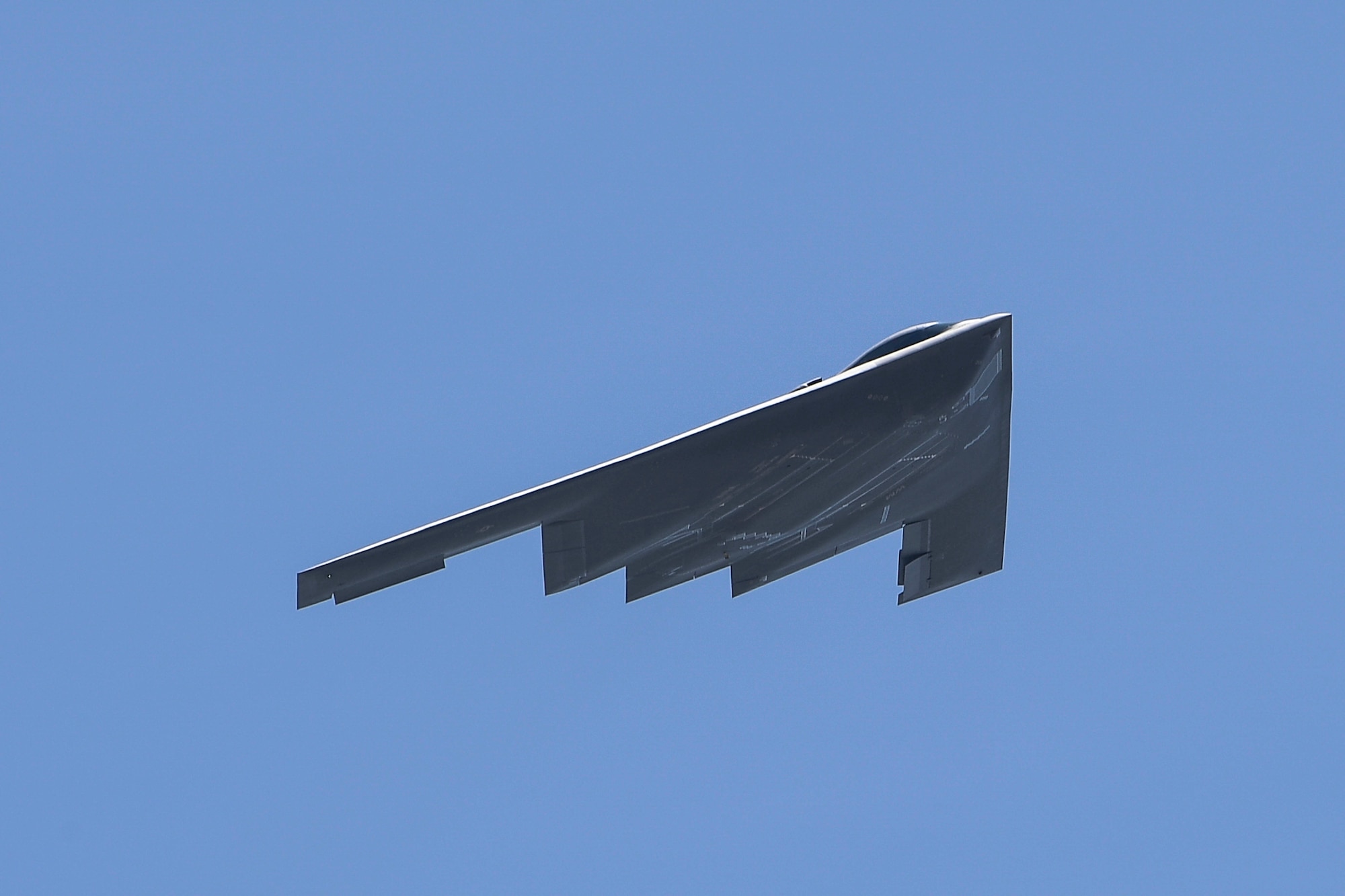 A B-2 Spirit stealth bomber flies through the skies above Plant 42 in Palmdale, California, April 12, 2019. The Air Force’s B-2 fleet undergoes undergo programmed depot maintenance every nine years at the Northrop Grumman facility at Plant 42. (Photo courtesy of Alan Radecki/Northrop Grumman)