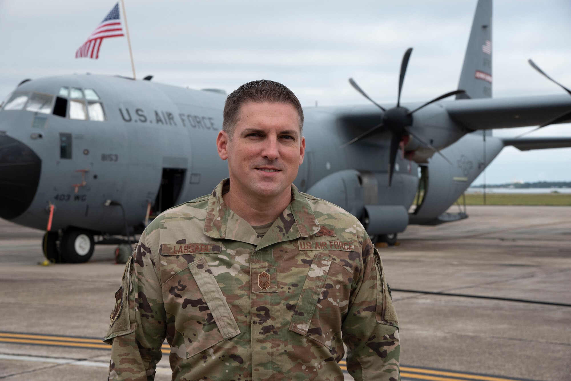 Chief Master Sgt. Thomas Lassabe, 403rd Maintenance Group superintendent at Keesler Air Force Base, Miss., pauses for a photo on the flight line Sept. 25, 2020. Lassabe's role in the 550-person organization is to provide the commander with information regarding operational effectiveness and the training and equipping of Airmen. (U.S. Air Force photo by Lt. Col. Marnee A.C. Losurdo)