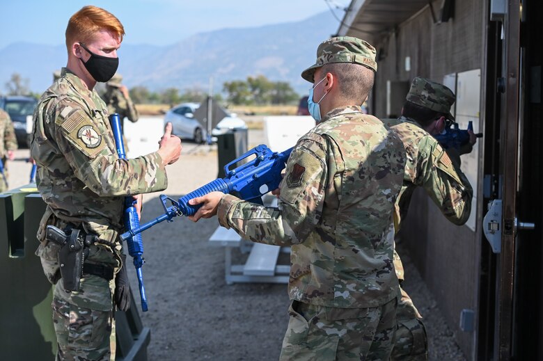 Staff Sgt. Matthew Kopf, 75th Security Forces (left), instructs Airmen how to search a room during an expeditionary active shooter training course Sept. 25, 2020, at Hill Air Force Base, Utah. The course is one part of the Hill Expeditionary Airman Readiness Training program, or HEART, where first-term Airmen are trained with basic readiness skills. (U.S. Air Force photo by Cynthia Griggs)
