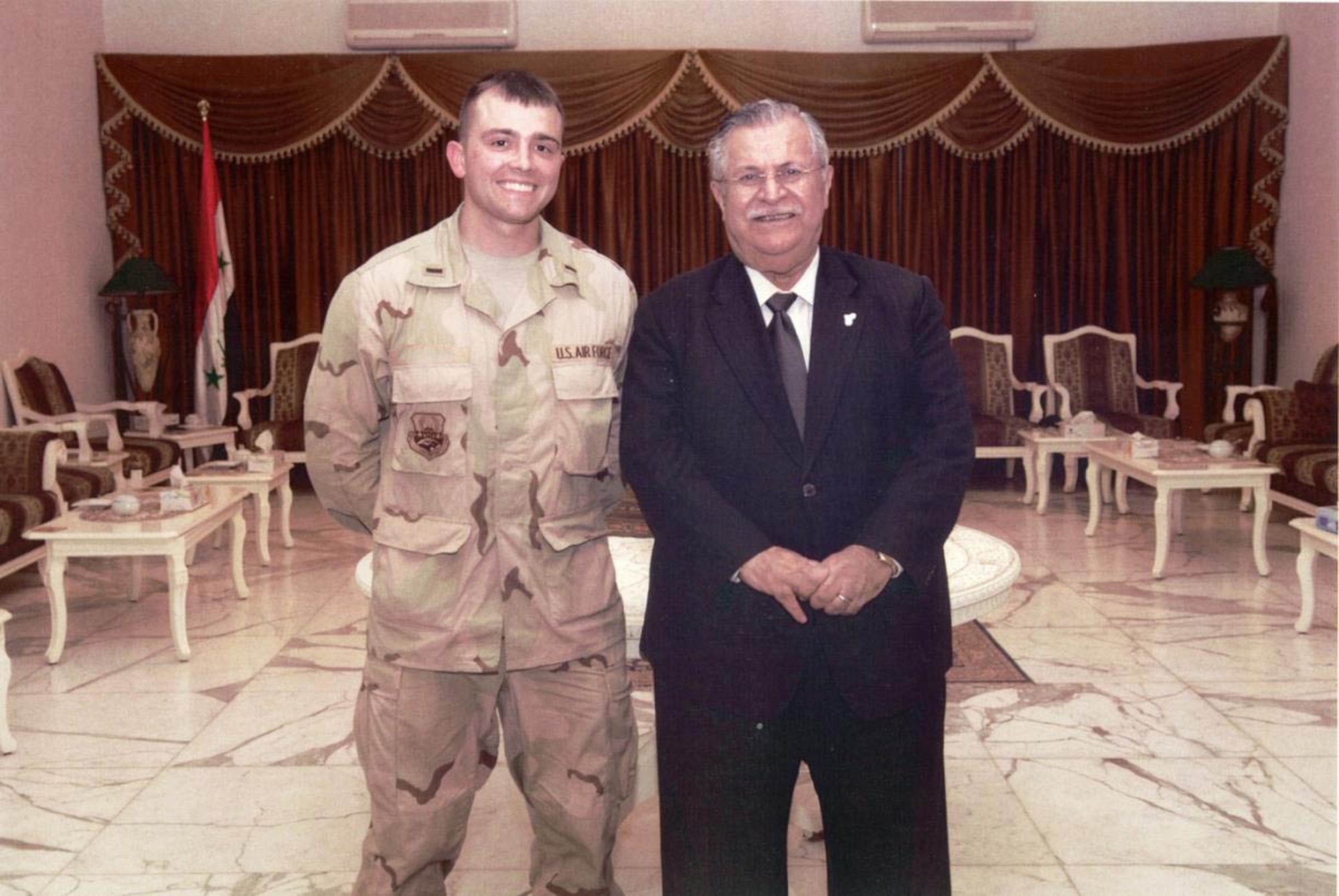 A young Lt. Col. Robert, now-15th Attack Squadron commander, stands alongside then-President of Iraq, President Talibani in Baghdad, Iraq, May 2007.
