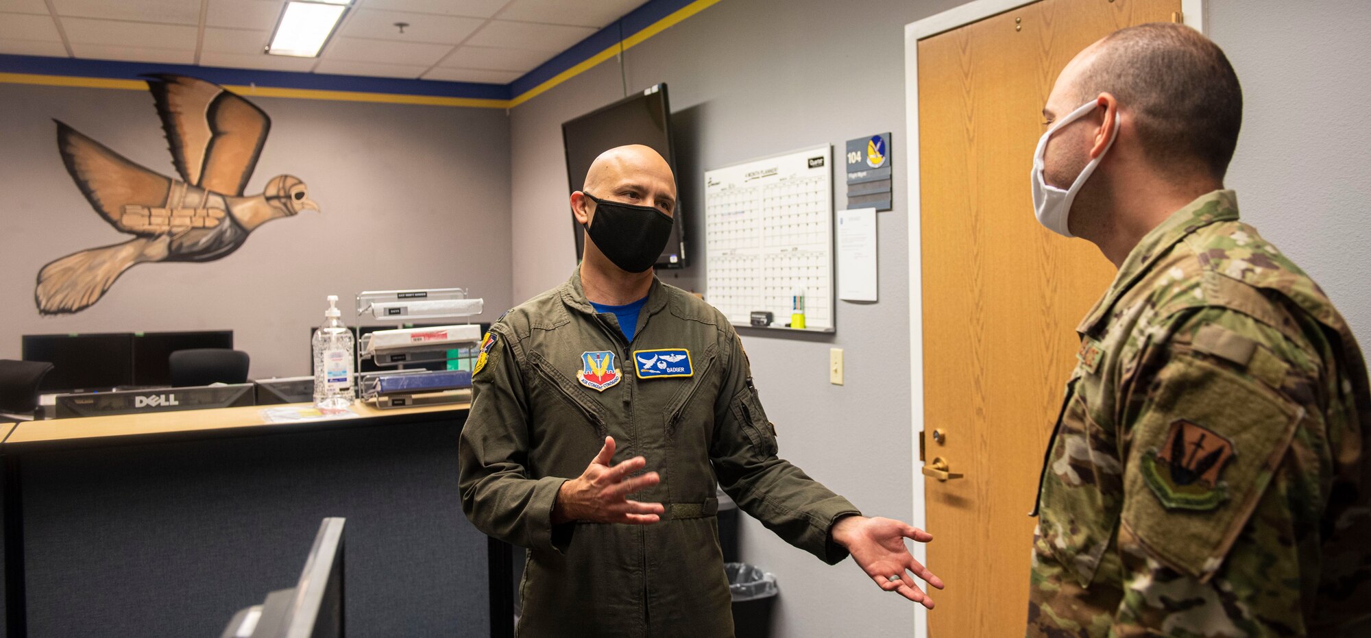 Lt. Col. Robert speaks to an airman in the 15th Attack Squadron.