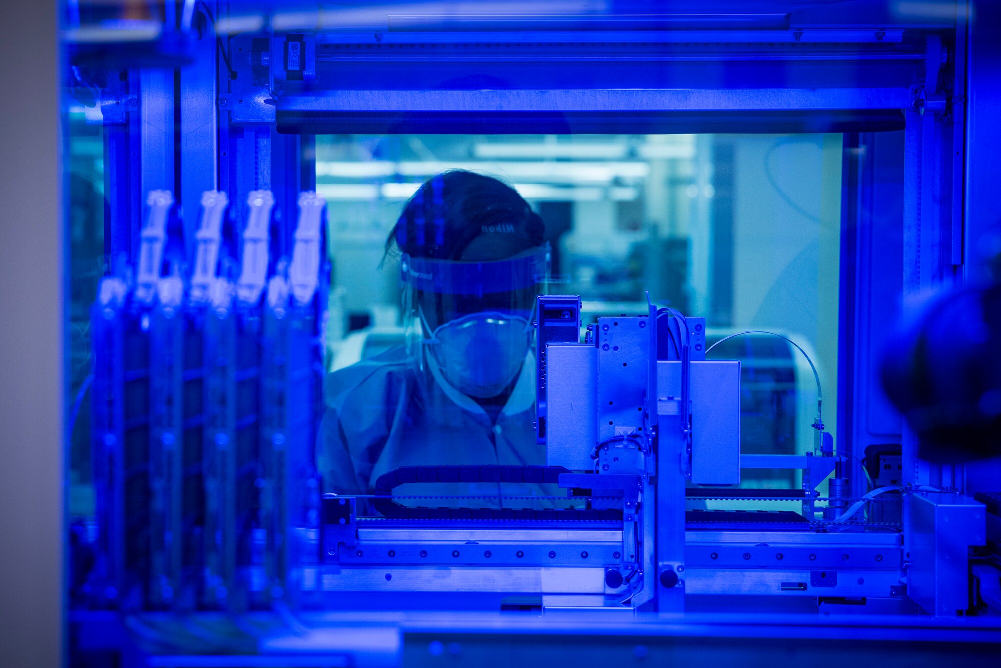 Staff Sgt. Alexis Shodeke, a medical laboratory technician in the United States Air Force School of Aerospace Medicine’s Epidemiology Laboratory, observes as new samples are tested for COVID-19 June 2, 2020. The Epi Lab is the sole clinical reference lab in the Air Force, and USAFSAM is part of AFRL’s 711th Human Performance Wing headquartered at Wright-Patterson Air Force Base in Dayton, Ohio. (U.S. Air Force photo/Richard Eldridge)