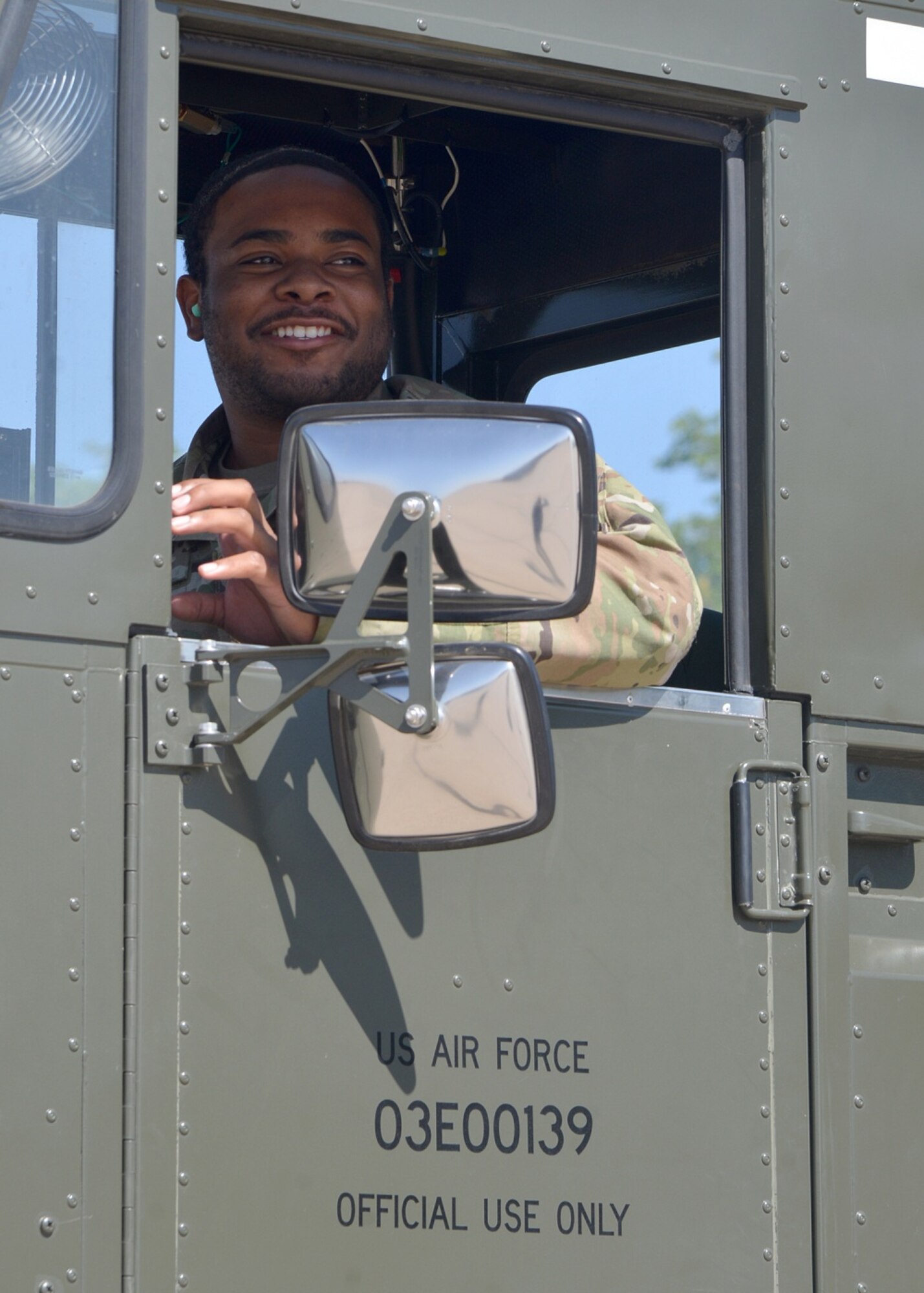 Man operates cargo loading vehicle