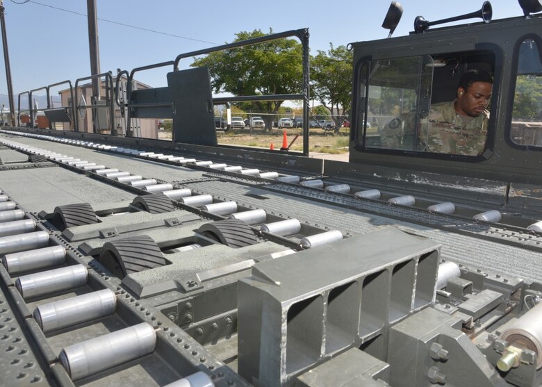 Man operates cargo loading vehicle