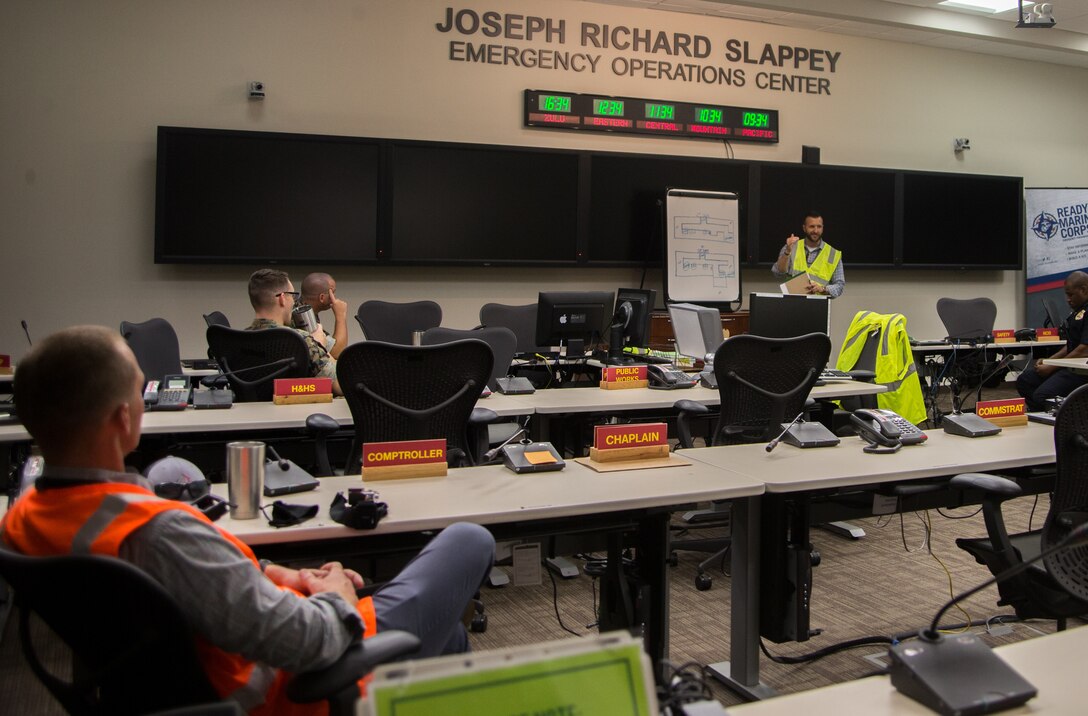 Service members and their civilian counterparts are briefed before an active shooter drill at Marine Corps Air Station Cherry Point, North Carolina, Sep. 23, 2020. The exercise simulated an active shooter threat in order to better prepare Marines and civilians in case of a real word scenario. (U.S. Marine Corps photo by Lance Cpl. Michael Neuenhoff)