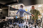 Jonathan Kwolek, a U.S. Naval Research Laboratory research physicist, shows an atom interferometer to Chief of Naval Research Rear Adm. Lorin Selby Sept. 14, 2020, at Naval Research Labratory (NRL) facilities in Washington, D.C.