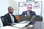 Ivorian Navy Capt. Charles Bamele speaks with Dr. Ian Ralby, CEO, I.R. Consilium, during the Obangame Express 2020 virtual Senior Leadership Symposium, Sept. 17, 2020. Leaders from the Gulf of Guinea, Europe, North America, and several regional and international organizations dialed in to participate in the symposium, which was postponed following the cancellation of the March 2020 exercise due to COVID-19.