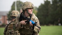 U.S. Air Force security forces member sweeps area