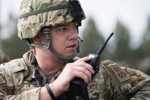 U.S. Air Force security forces member uses radio