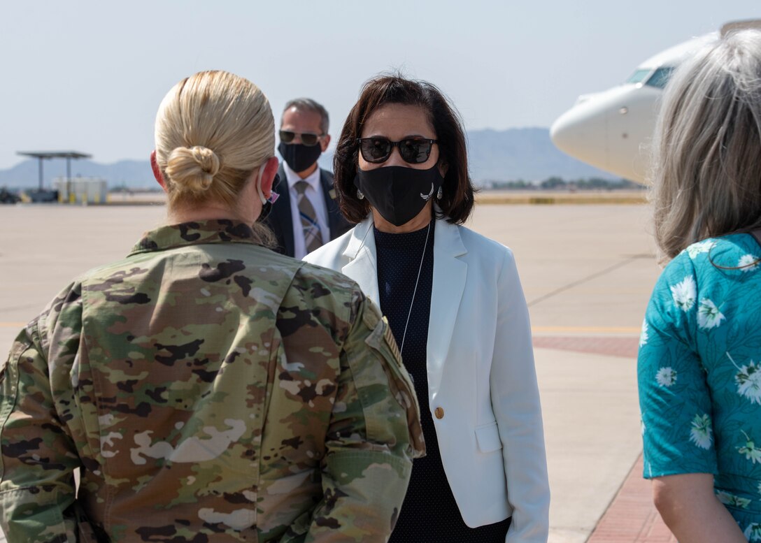 Sharene Brown, wife of Air Force Chief of Staff Gen. Charles Brown, greets Chief Master Sgt. Catherine Buchanan, 944th Fighter Wing command chief, upon arrival to Luke Air Force Base, Ariz., Sept. 17, 2020. Brown, Secretary of the Air Force Barbara Barrett and Karen Pence, wife of Vice President Mike Pence, visited Luke AFB to engage with military spouses and discuss military spouse employment. (U.S. Air Force photo by Airman 1st Class Brooke Moeder)