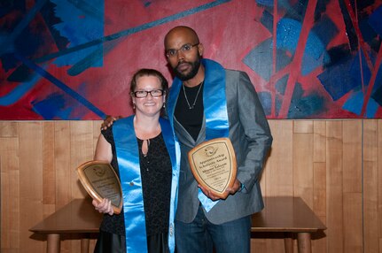 Mtume Salaam (right), the new Deputy Apprentice Program Administrator at Puget Sound Naval Shipyard & Intermediate Maintenance Facility Detachment San Diego, with Deborah Fulbright, 2014 Apprentice of the Year, at the 2014 Apprentice Program graduation. (PSNS & IMF photo by Wendy Hallmark)