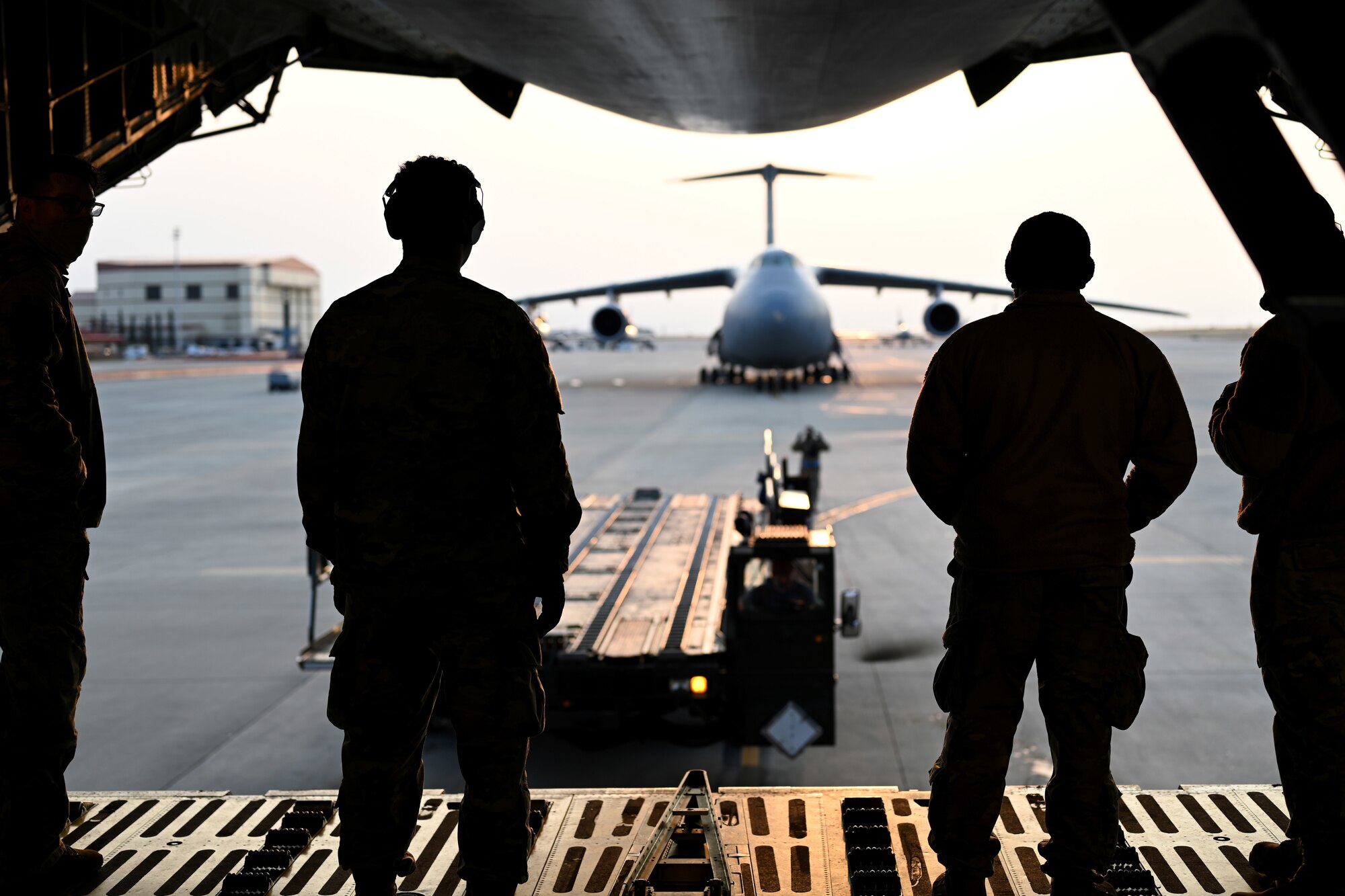 Photos of 22nd Airlift Squadron Airmen loading humanitarian aid at Travis AFB and delivering it to Guatemala.