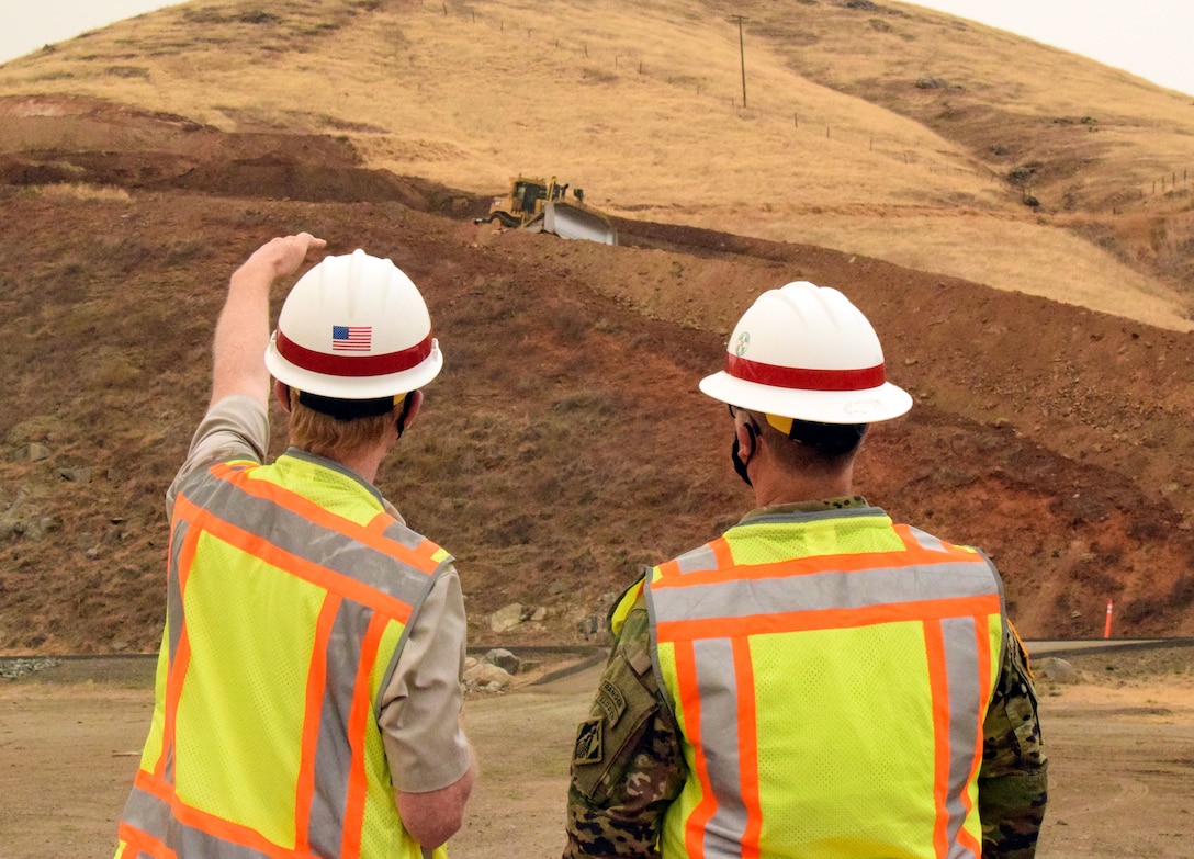 USACE Sacramento District Commander COL James Handura (right) gets a construction update as groundbreaking gets underway on the Tule River Spillway Enlargement Project at Success Lake near Porterville, California.