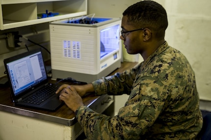 Sgt. Adrian Willis, a computer and telephone technician with Combat Logistic Battalion 31, 31st Marine Expeditionary Unit, edits software for a 3-D printer aboard the USS Wasp (LHD-1) while underway in the Pacific Ocean, March 22, 2018. Marines with CLB-31 are now capable of ‘additive manufacturing,’ also known as 3-D printing, which is the technique of replicating digital 3-D models as tangible objects. The 31st Marine Expeditionary Unit partners with the Navy’s Amphibious Squadron 11 to form the Wasp Amphibious Ready Group, a cohesive blue-green team capable of accomplishing a variety of missions across the Indo-Pacific. (U.S. Marine Corps photo by Cpl. Stormy Mendez/Released)