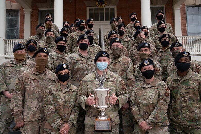 The 790th Missile Security Forces Squadron Airmen pose for photos with the Cheyenne Trophy on F.E. Warren Air Force Base, Wyoming, Sept. 10, 2020. The Greater Cheyenne Chamber of Commerce recently presented the Military Affairs Committee’s Cheyenne Trophy to the 790th Missile Security Force Squadron for mission accomplishments, patriotism, off-duty volunteerism and community involvement resulting in a positive impact on the city of Cheyenne and its residents. (U.S. Air Force photos by Joseph Coslett)