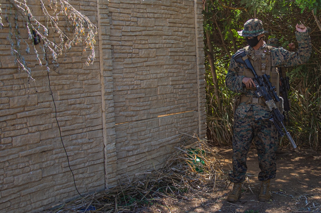 A U.S. Marine with Company F, 2nd Battalion, 3rd Marine Regiment, identifies a simulated improvised explosive device during Exercise Bougainville I on Marine Corps Base Hawaii, Aug. 19, 2020. Bougainville I is designed to train and evaluate team leaders in small unit proficiency and increase the Battalion’s combat readiness. (U.S. Marine Corps photo by Cpl. Jacob Wilson)