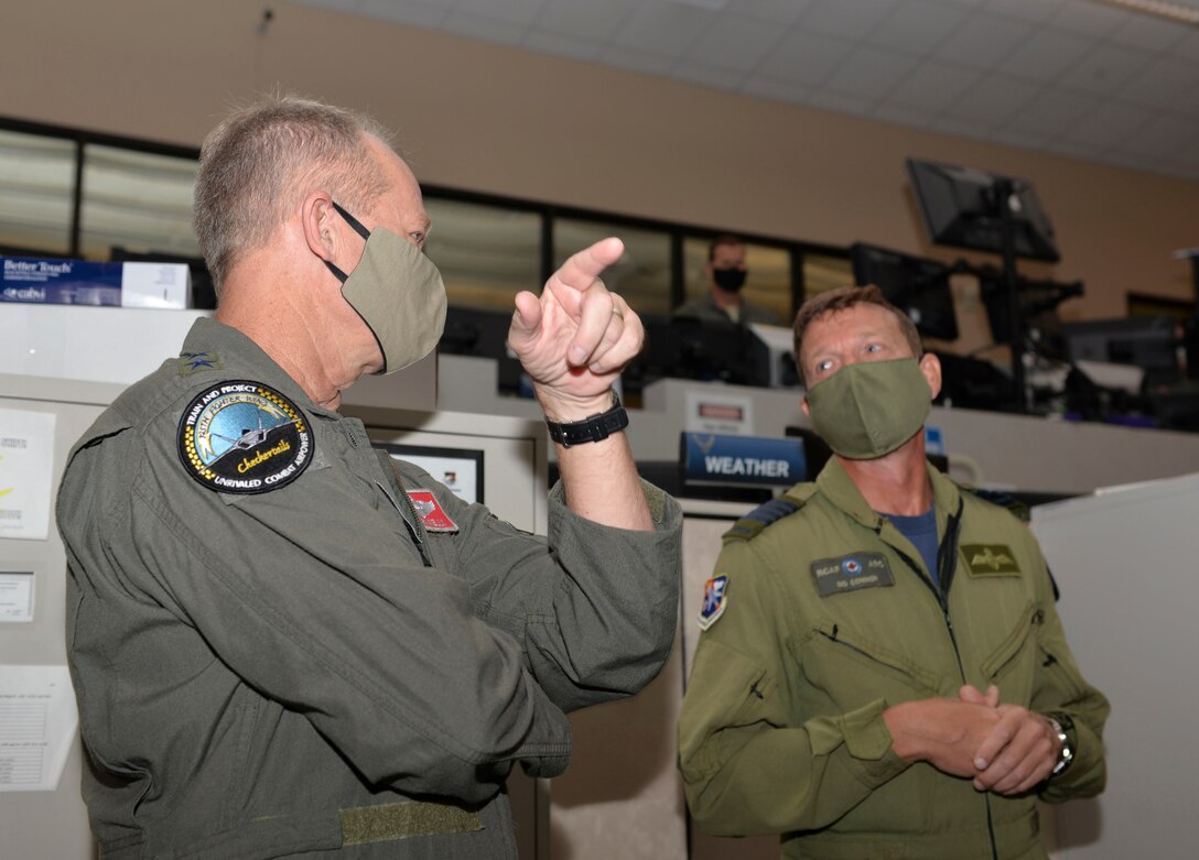 U.S. Air Force Gen. Mark Kelly, commander of Air Combat Command, talks with Royal Canadian Air Force Col. Sidney Connor, 601st Air Operations Center deputy commander, during a visit to Tyndall Air Force Base, Florida, Sept. 29, 2020.