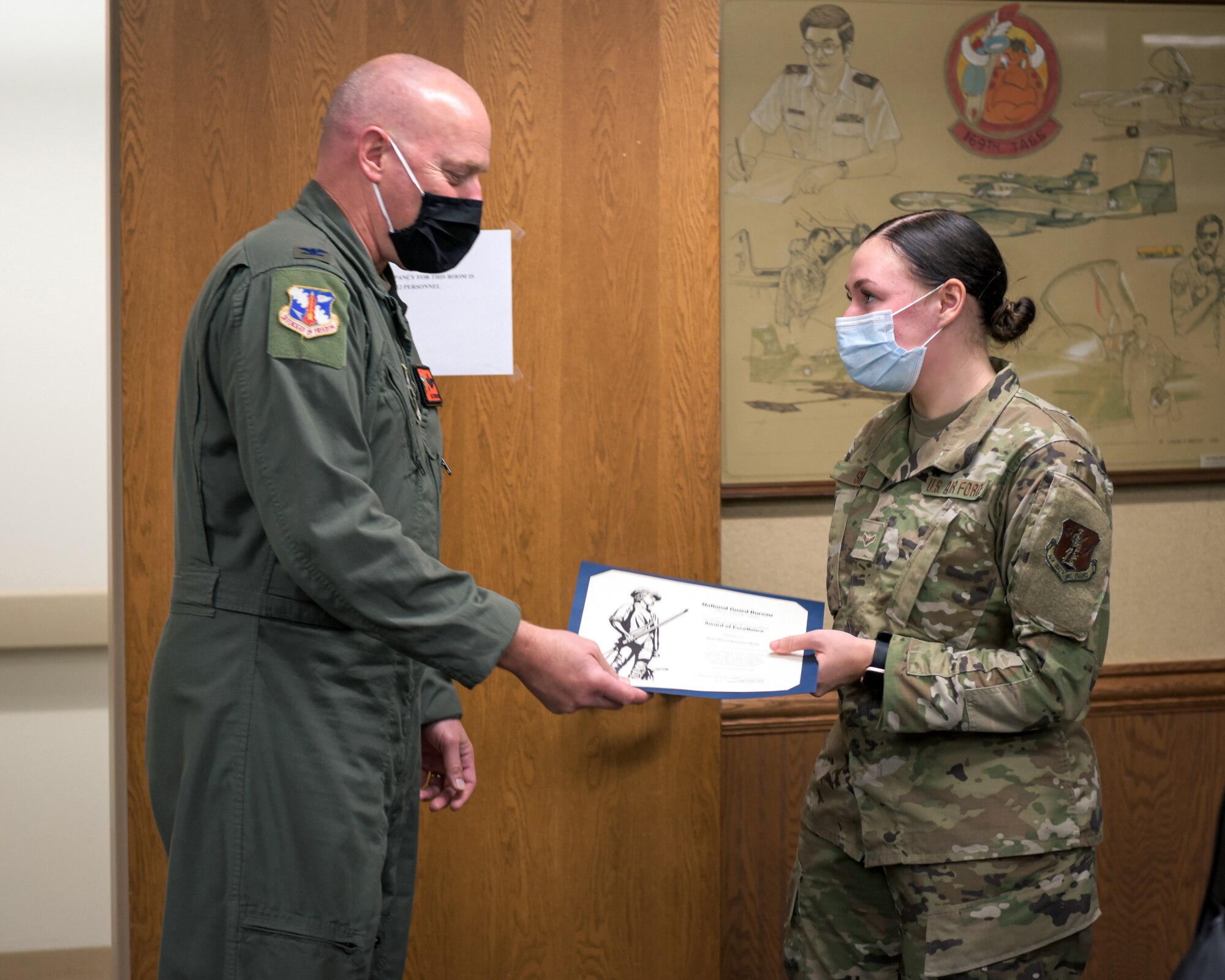 Airman receiving award.