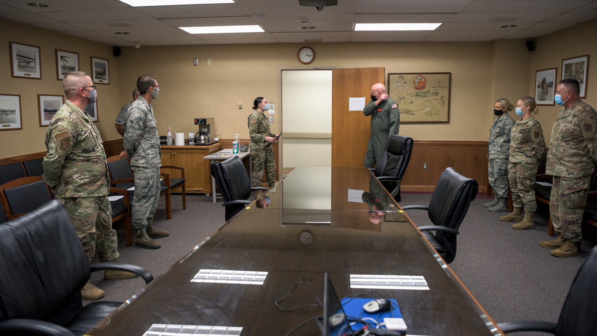 Airmen in meeting room.