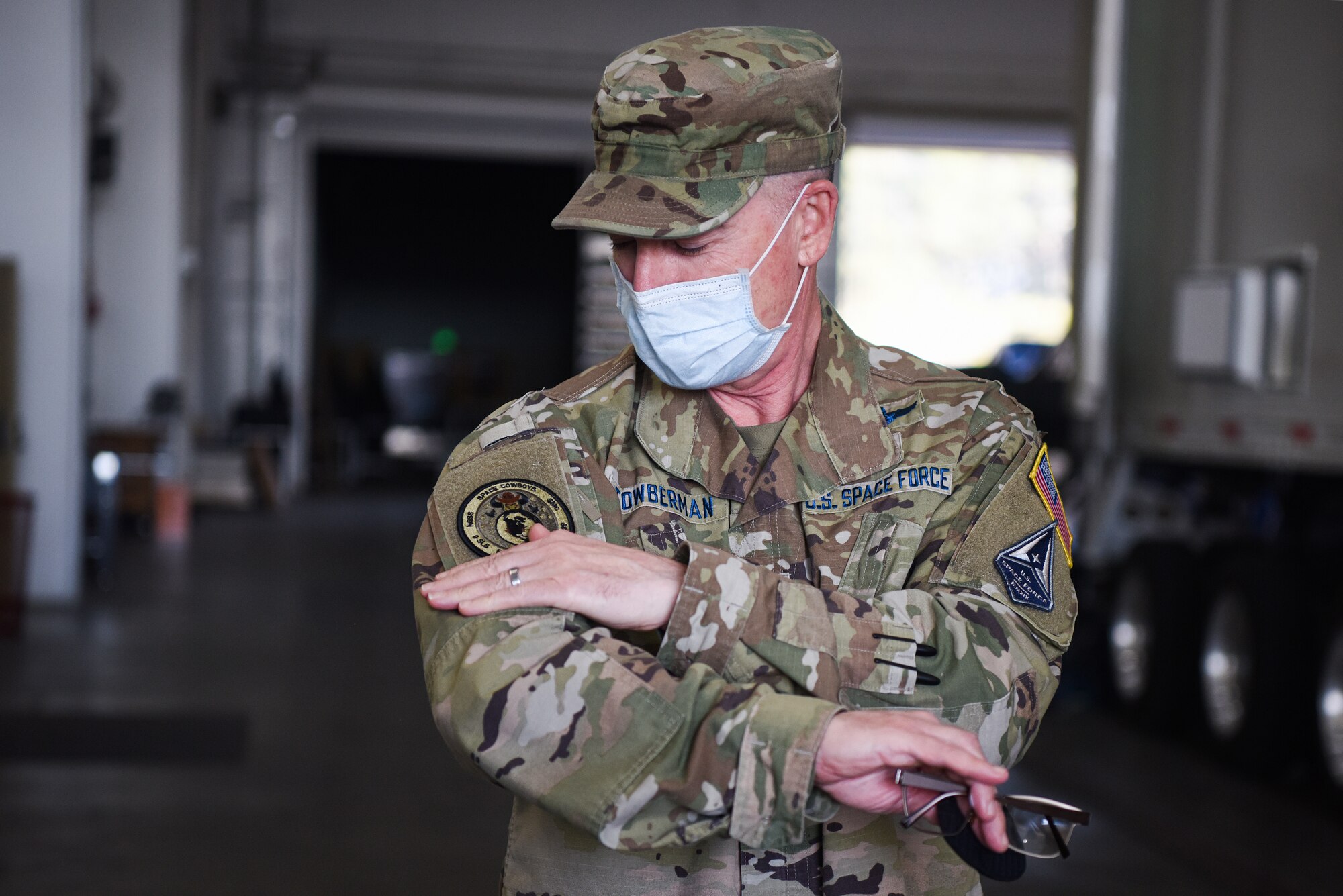 Chief Master Sgt. Roger A. Towberman, U.S. Space Force senior enlisted advisor, puts on the 2nd Space Launch Squadron ‘Space Cowboys’ patch Sept. 23, 2020, at Vandenberg Air Force Base, Calif. The 2 SLS ‘Space Cowboys’ briefed Towberman on current operations, upcoming launches, and their key role in the space warfighting mission. (U.S. Space Force photo by Senior Airman Hanah Abercrombie)