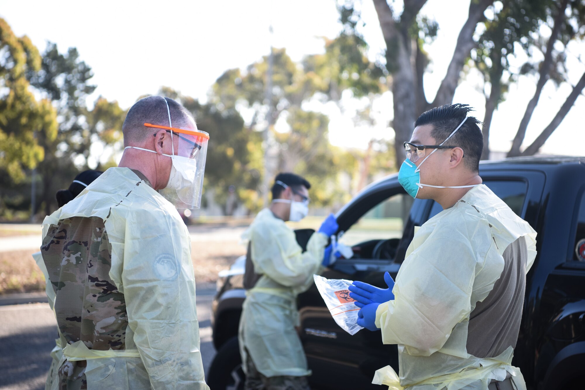 Chief Master Sgt. Roger A. Towberman, U.S. Space Force senior enlisted advisor, is shown how COVID-19 test are performed at the 30th Medical Group Sept. 24, 2020, at Vandenberg Air Force Base, Calif. Airmen from across the 30th MDG briefed Towberman on the innovative medical capabilities the unit has used to support U.S. Air Force and U.S. Space Force professionals across the installation. The Airmen demonstrated their current COVID-19 testing capabilities, in addition to their air quality assessments, which are used as a precaution due to the California wildfires that have elevated the base’s Air Quality Index. (U.S. Space Force photo by Senior Airman Hanah Abercrombie)