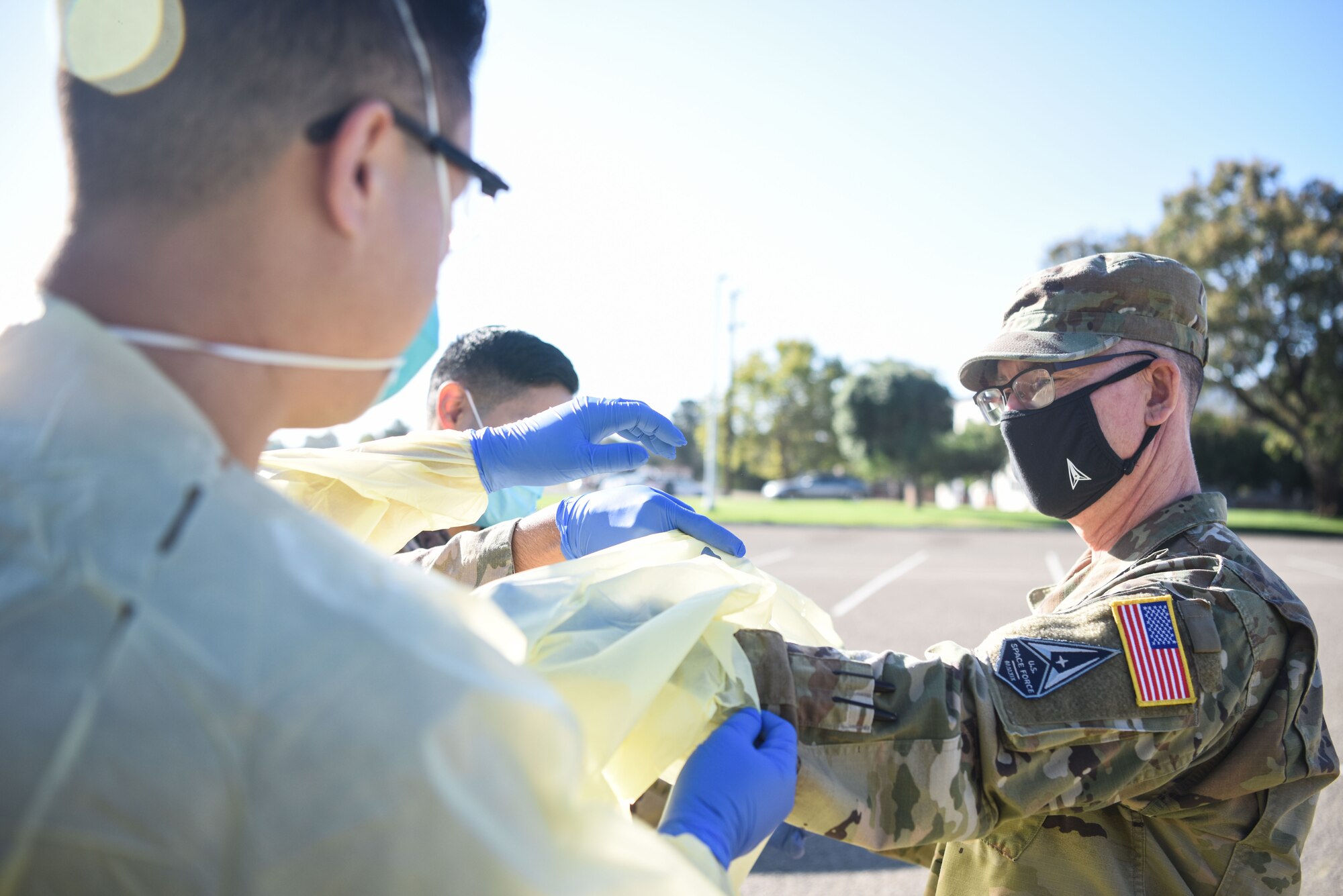 Chief Master Sgt. Roger A. Towberman, U.S. Space Force senior enlisted advisor, is shown how COVID-19 test are performed at the 30th Medical Group Sept. 24, 2020, at Vandenberg Air Force Base, Calif. Airmen from across the 30th MDG briefed Towberman on the innovative medical capabilities the unit has used to support U.S. Air Force and U.S. Space Force professionals across the installation. The Airmen demonstrated their current COVID-19 testing capabilities, in addition to their air quality assessments, which are used as a precaution due to the California wildfires that have elevated the base’s Air Quality Index. (U.S. Space Force photo by Senior Airman Hanah Abercrombie)