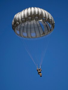 A Texas National Guard Paratrooper from the 197th Special Troops Support Company, 36th Sustainment Brigade, parachutes to the ground over Joint Base San Antonio-Camp Bullis Sept. 25. Soldiers assigned to airborne units must complete a parachute jump every three months to maintain their airborne status.