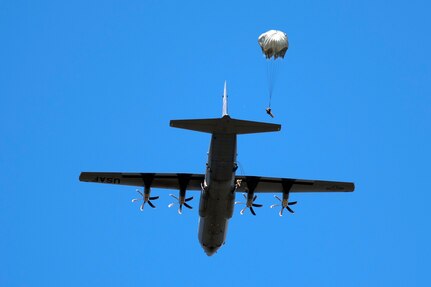 Texas National Guard Paratroopers from the 197th Special Troops Support Company, 36th Sustainment Brigade, jump out of a C-130 aircraft over Joint Base San Antonio-Camp Bullis Sept. 25. Soldiers assigned to airborne units must complete a parachute jump every three months to maintain their airborne status.
