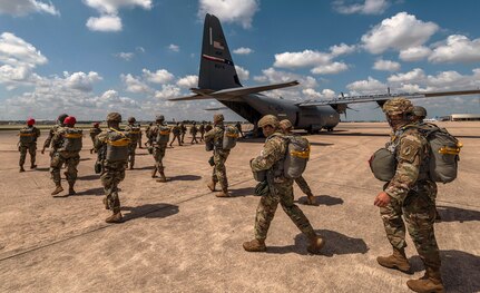 Texas Army National Guard soldiers assigned to the 197th Special Troops Support Company, Joint Base San Antonio-Camp Bullis, prepare for airborne operations training Sept. 25 at JBSA-Lackland. Soldiers loaded onto a C-130J Super Hercules, from the 317th Airlift Wing, Dyess AFB, Texas to complete static line jump training onto a drop zone at JBSA-Camp Bullis. Soldiers assigned to airborne units must complete a parachute jump every three months to maintain their airborne status.