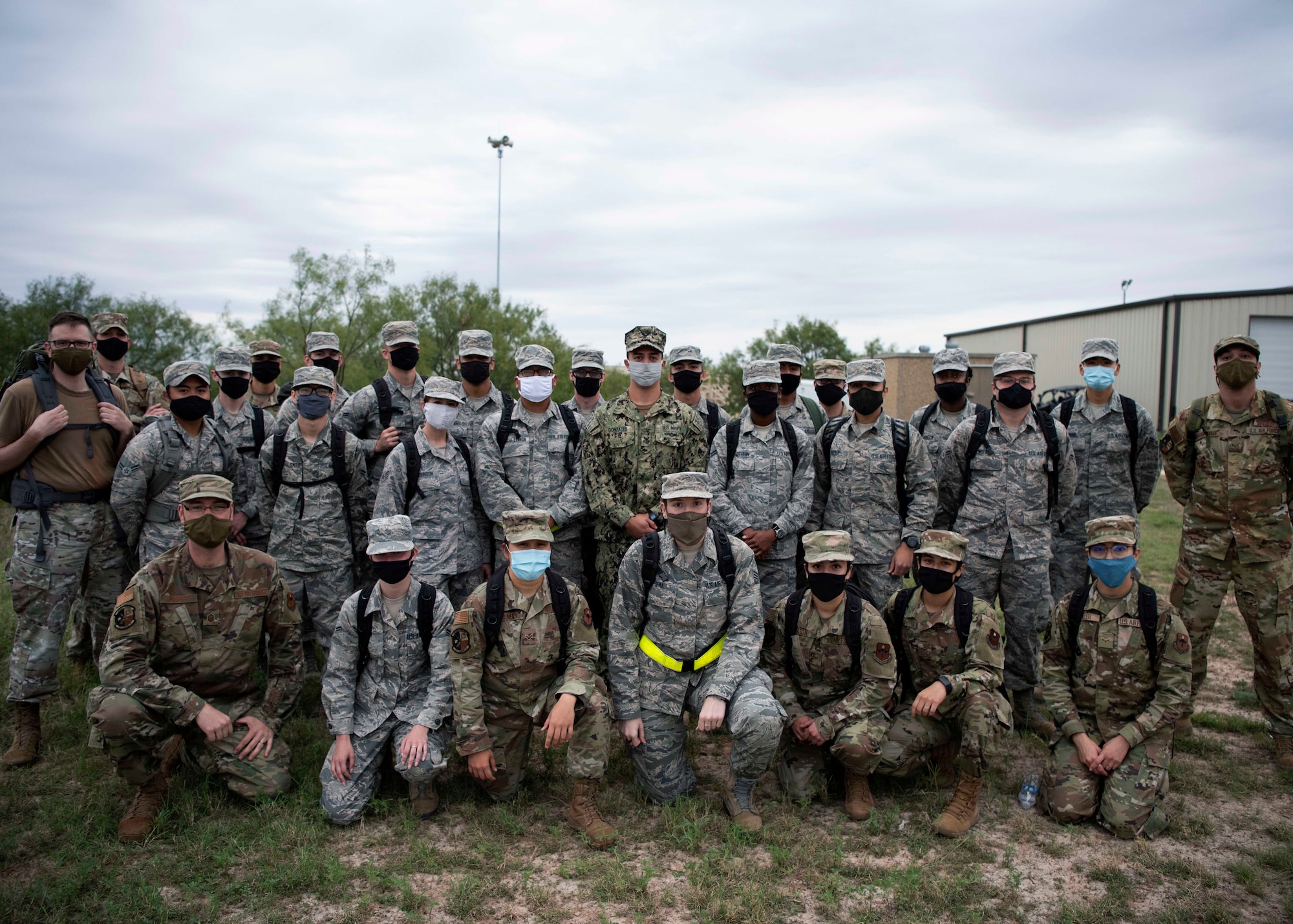 Goodfellow members pose for a post-ruck photo after the Jacobson Ruck March on Goodfellow Air Force Base, Texas, Sept. 28, 2020. Each member filled a rucksack with canned food to donate to a local food bank. (U.S. Air Force photo by Airman 1st Class Michael Bowman)