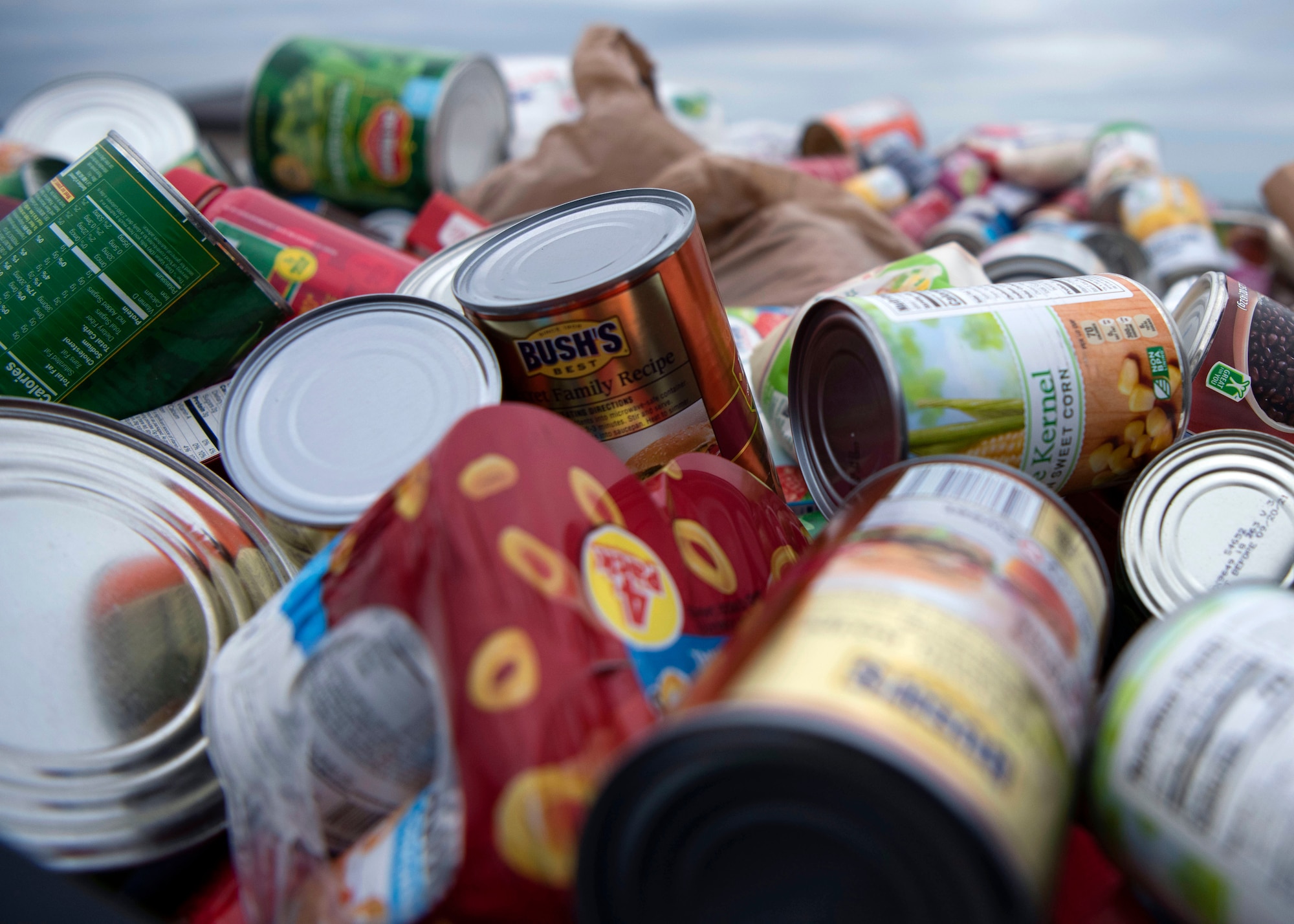 Canned food donations are piled in a truck bed ready to be packed into rucksacks at the Jacobson Ruck March on Goodfellow Air Force Base, Texas, Sept. 28, 2020. Each member brought a canned food donation for the food bank and filled their rucksacks with the cans to add weight. (U.S. Air Force photo by Airman 1st Class Michael Bowman)