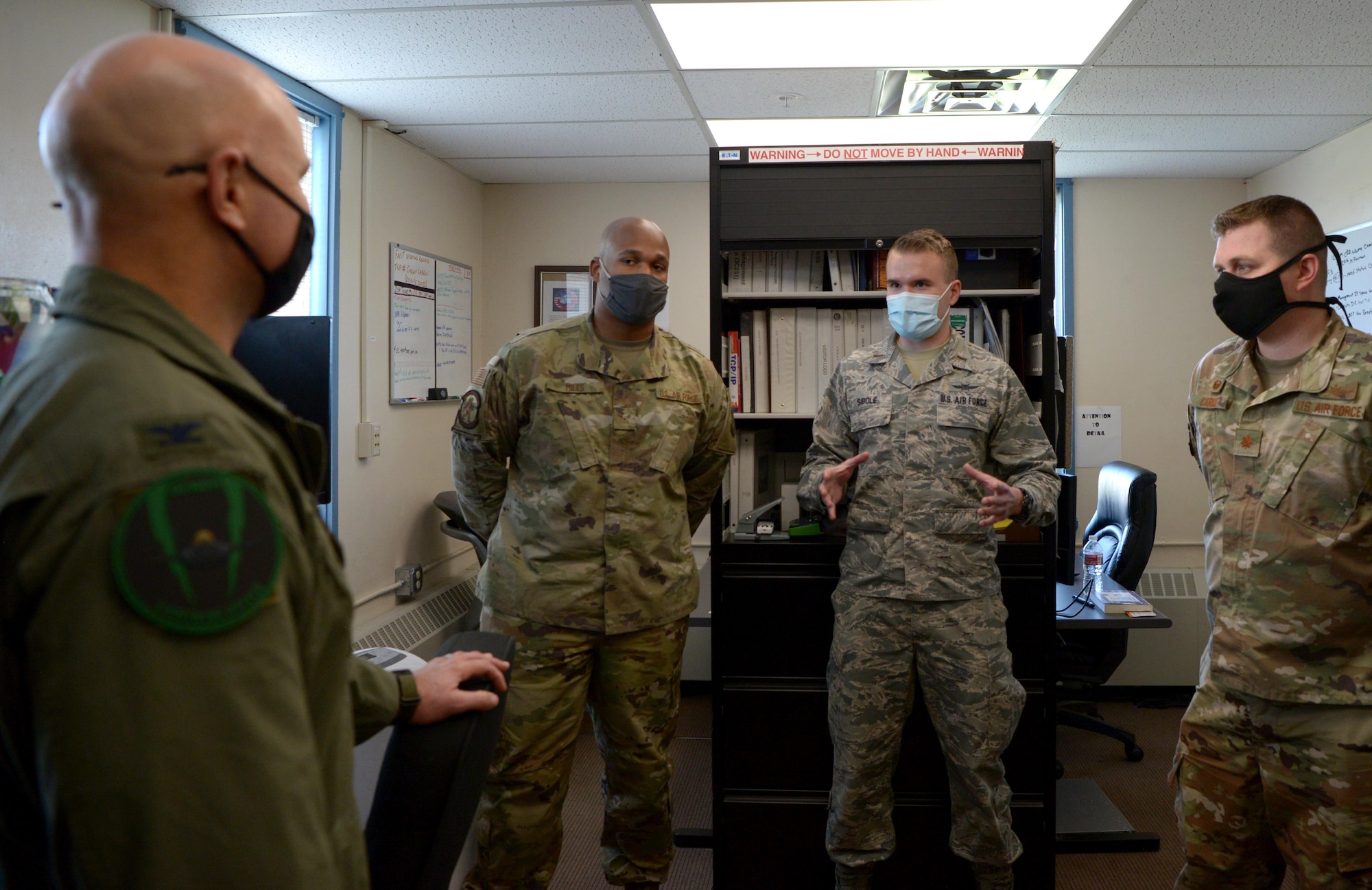 U.S. Air Force Col. David Berkland (left), the 354th Fighter Wing commander, speaks with Airmen from the 354th Communications Squadron during a wing leadership immersion on Eielson Air Force Base, Alaska, Sept. 29, 2020. Airmen shared their roles and responsibilities with the commander to explain the intricate process of defending Eielson’s cyber network. (U.S. Air Force photo by Senior Airman Beaux Hebert)