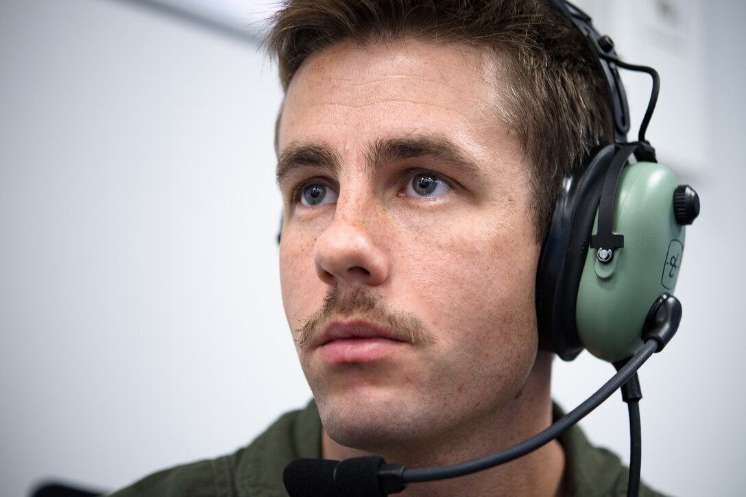 Photo of Airman wearing headset
