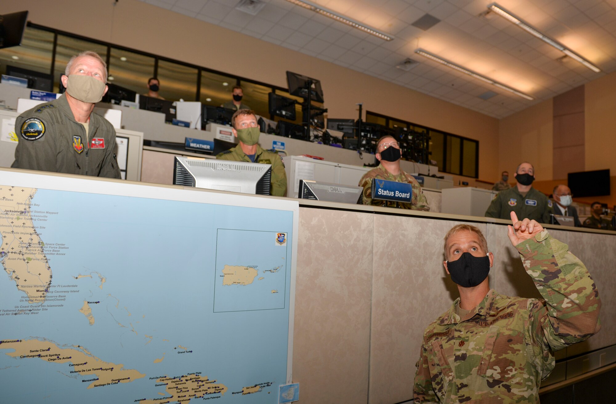 U.S. Air Force Maj. John Heatherly, 601st Air Operations Center Combat Plans Division, briefs U.S. Air Force Gen. Mark Kelly, commander of Air Combat Command, and U.S. Air Force Chief Master Sgt. David Wade, the command chief of Air Combat Command, on how the AOC conducts missions throughout the continental United States during a visit to Tyndall Air Force Base, Florida, Sept. 29, 2020.