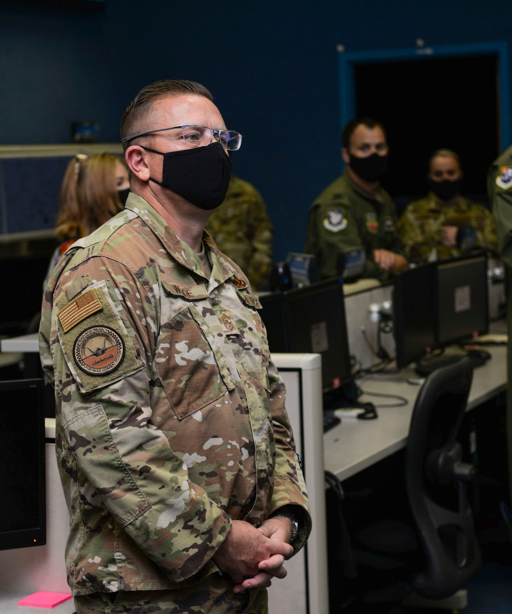 U.S. Air Force Chief Master Sgt. David Wade, the command chief of Air Combat Command, listens to a briefing on the 601st Air Operations Center’s air mobility operations during a visit to Tyndall Air Force Base, Florida, Sept. 29, 2020.