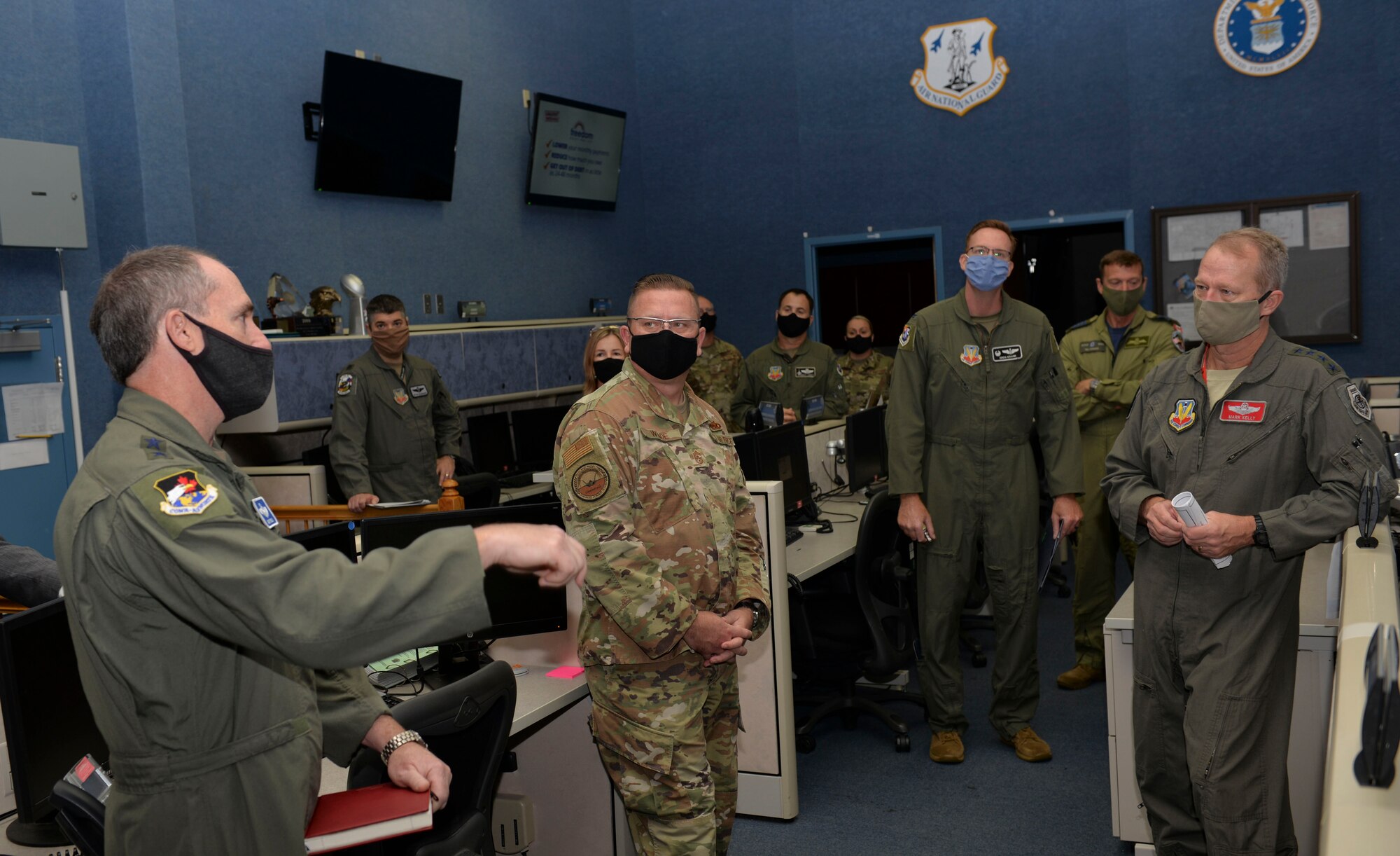 U.S. Air Force Lt. Gen. Kirk Pierce, 1st Air Force commander, speaks with U.S. Air Force Gen. Mark Kelly, commander of Air Combat Command, and U.S. Air Force Chief Master Sgt. David Wade, the command chief of Air Combat Command, during a visit to Tyndall Air Force Base, Florida, Sept. 29, 2020.